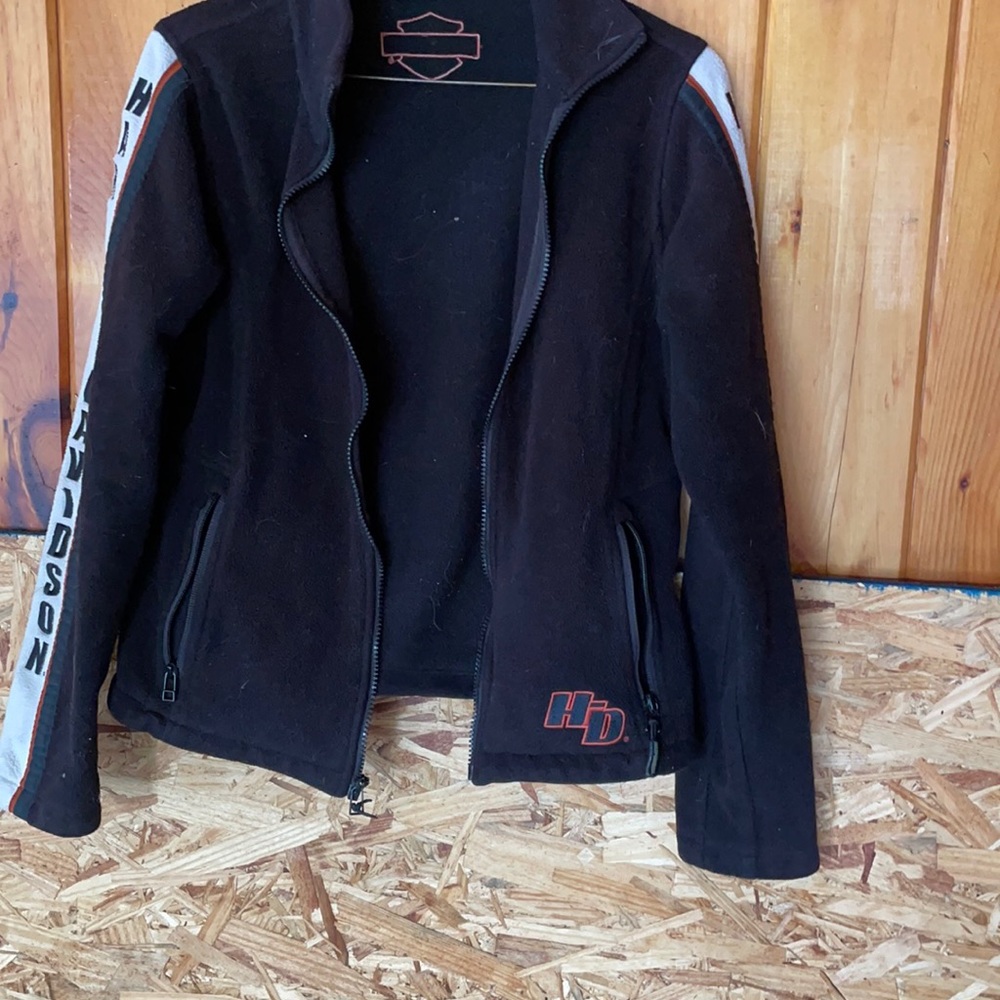 Black little white and orange zip up jacket